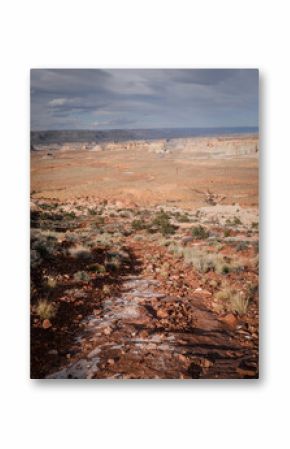 View of rocky off roading trail in pink Vermillion Cliffs near Big Water Utah and Page Arizona