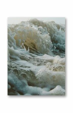 A surfer rides a wave in the ocean