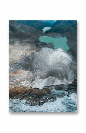 Aerial view of the Fellaria glacier in Valmalenco, Sondrio, Lombardy. Italy. Ice cliff, rock face with waterfalls and lake. Marson glaciological trail. Climate change, melting glaciers