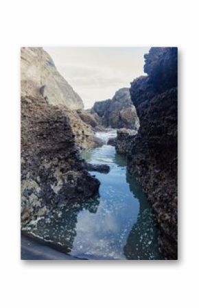 Oceanwaves going inot rockpools in Piha, Auckland, New Zealand.