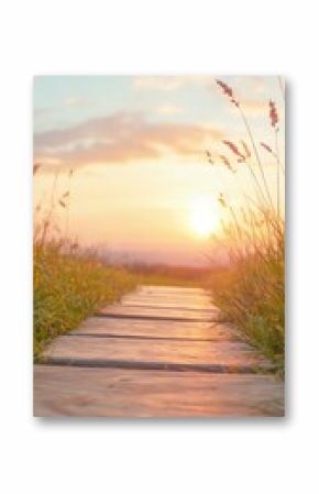 Wooden Path Leading to a Sunset Over a Grassy Field