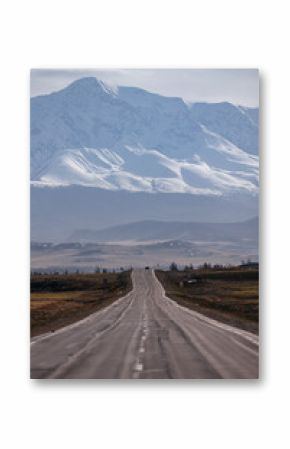 Beautiful autumn road with snow-covered peaks mountains North Chuya mountain ridge in Altai, Siberia, Russia