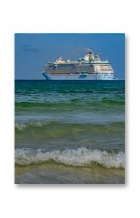 Cruise ship on the ocean. Luxury liner at ocean waves water. Miami Beach with cruise ship. Turquoise water and cruise liner. Tourist cruise ship near the coast. Ocean waves and vessel boat.