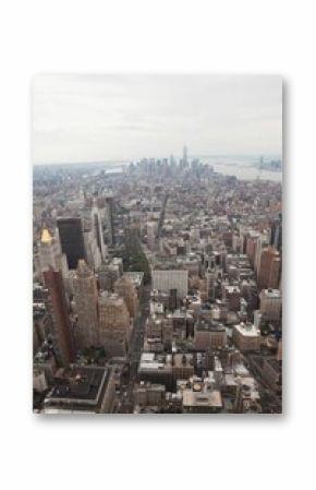 Depicting Manhattan skyline rising in flat design, showing grid streets with skyscrapers and taxis