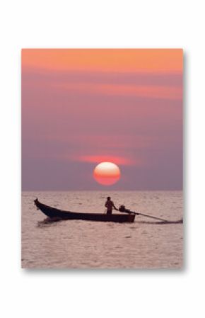 a lone fisherman on a traditional Thai longtail boat sailing on the sea under the setting orange sun. The concept for marketing travel and excursions is Beautiful marine