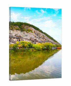 View of the historic Longmen Grottoes along the Yi River in Luoyang, China.