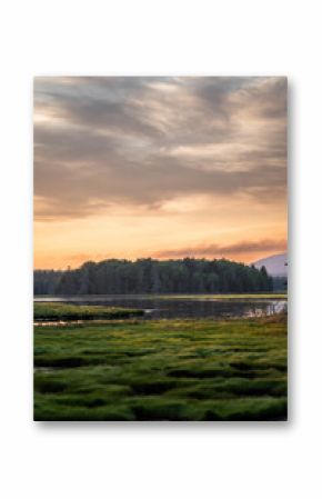 Sunset in Arcadia, Maine USA over a river and mountain landscape.