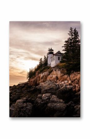 Bar Harbor, Maine Sunset in the Summer. Atlantic Ocean View with warm sky behind the lighthouse.