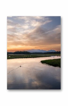 Sunset in Arcadia, Maine USA over a river and mountain landscape.