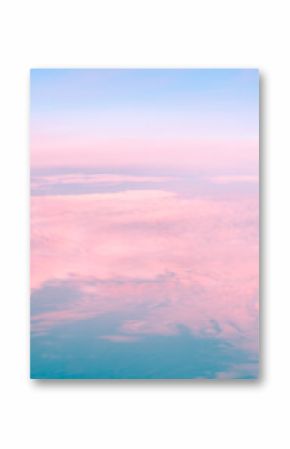Pink clouds are creating a beautiful and dreamy landscape during sunset, with a clear blue sky above them, offering a stunning view of nature's artistry