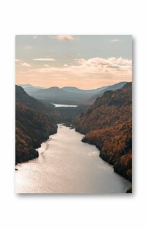 Up State New York in the Adirondack State Park during peak Fall Autumn season with golden maple leaves along the Hudson river. Trail up the Indian Head Lake view point.