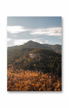 Up State New York in the Adirondack State Park during peak Fall Autumn season with golden maple leaves along the Hudson river. Trail up the Indian Head Lake view point.