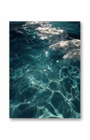 Reflective Ocean Surface With Shimmering Light During Midday in a Tranquil Sea
