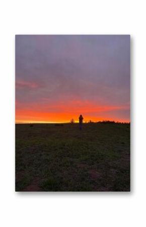 silhouette of a couple walking on a sunset