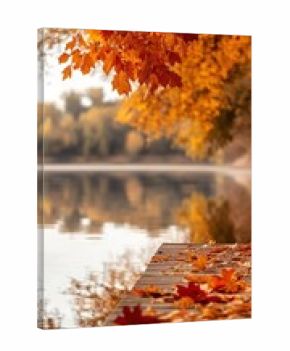Autumn leaves hanging over peaceful lake and fallen foliage on dock, creating tranquil fall scene with copy space for banner, seasonal retreat or nature concept