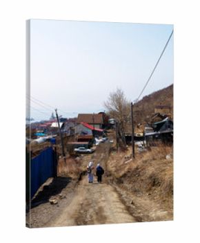 tourists on dirty road in Petropavlovsk-Kamchatsky