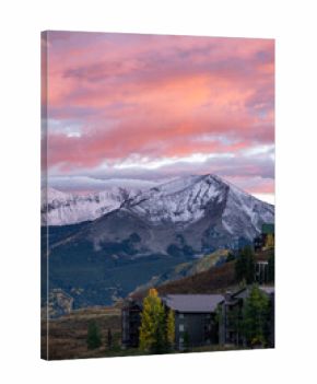 Romantic sunset at Crested Butte town with snowcapped mountain during fall foliage, a ski town in the Rocky mountains of Colorado, USA