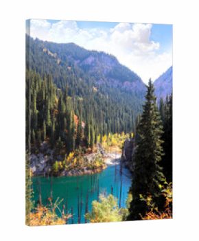 Picturesque autumn scenery of Kaindy lake with dead trees, Kolsay Lakes National Park, northern region of Tien Shan Mountains, Kazakhstan. Alpine Kaindy lake, Almaty region, Kazakhstan