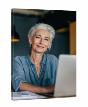 smiling mature middle aged business woman using laptop working on computer sitting at desk happy old businesswoman hr holding cv interviewing distance applicant senior seeker searching job online no 
