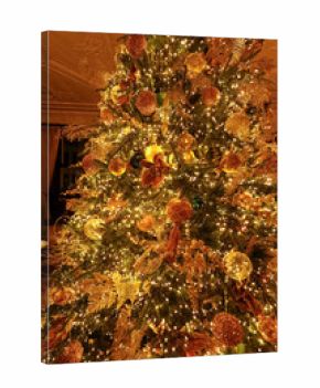 Christmas tree decorated with golden ornaments and sparkling lights celebrating festive holiday season in London