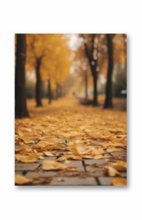 Idyllic scene with yellow fallen leaves in an autumn park vertical