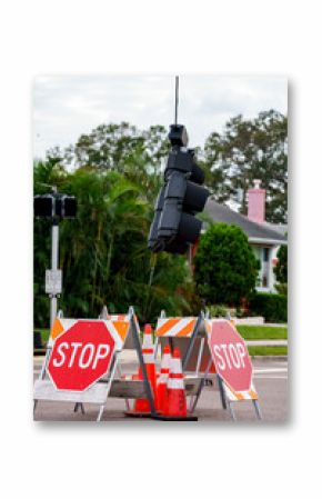 Traffic light hanging by a wire after Hurricane Milton St Petersburg Florida