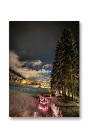 Scenic view of illuminated Wolkenstein in Gröden Selva in Val Gardena covered with snow at night