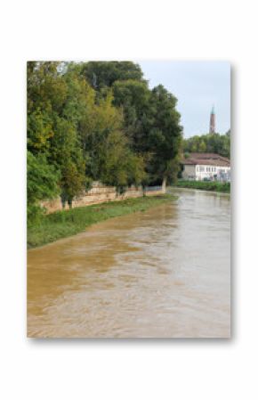 retaining wall along the riverbank during flood caused by rains