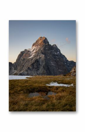 sunset at peak of Mt. Watzmann with reflection in a pond, Berchtesgaden national park, bavaria, Germany