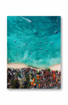 Nusa Lembongan island with coastline and turquoise sea with boats, above drone view, vertical screen