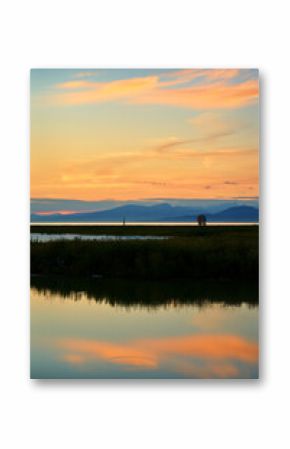 Salish Sea West Dyke Sunset. Sunset clouds over the Garry Point marshes on the edge of the Salish Sea. Richmond, British Columbia, Canada near Vancouver.  