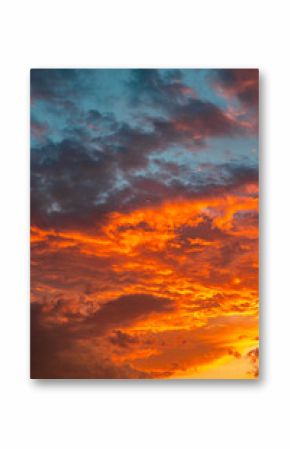 Orange clouds at sunset. Dramatic clouds background vertical photo
