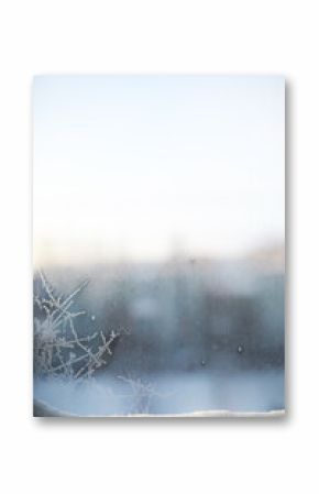 Frosty Winter Window with Delicate Ice Crystals on a Cold Morning