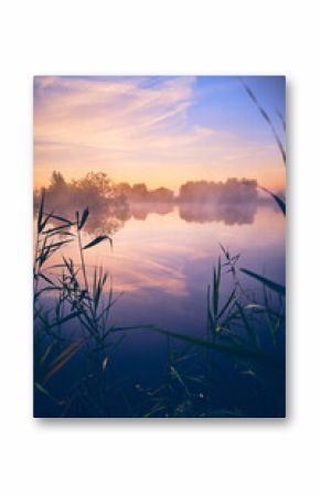 Calm lake at colorful sunrise. High quality photo