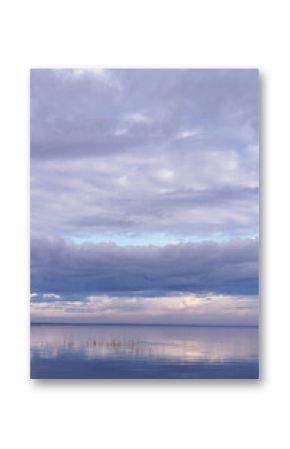 Beautiful white blue clouds over lake, symmetric sky background, cloudscape on lake Ik, Russia. Nature abstract, cloudy sky reflected on water, calm windless weather, natural environment