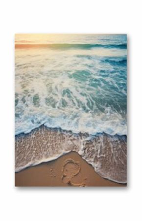 A beach with a large wave and a small footprint in the sand. The footprint is a heart shape