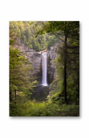 Tall beautiful waterfall cascading down from massive cliffs. Taughannock Falls State Park - Trumansburg Upstate New York 