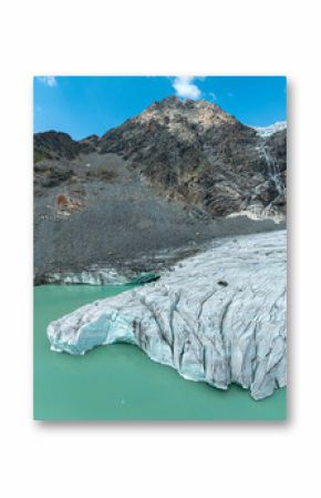 Aerial view of the Fellaria glacier in Valmalenco, Sondrio, Lombardy. Italy. Ice cliff, rock face with waterfalls and lake. Marson glaciological trail. Climate change, melting glaciers