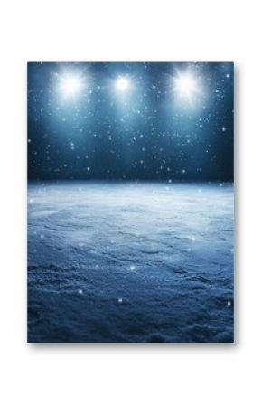 Snowy landscape with bright light shining down on the ground during a winter night with falling snow in a cold environment