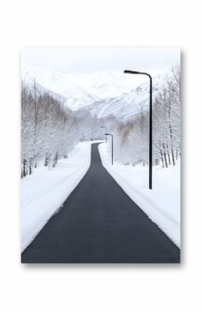 Snowy Road Winding Through a Snow Covered Mountain Landscape