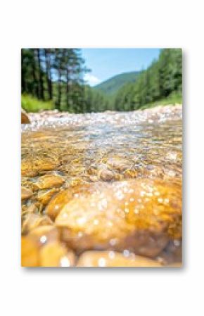 Clear River Water Flowing Over Smooth Stones in Mountain Valley