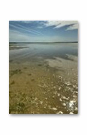 Panoramic view of serene coastal landscape under a vibrant sunny sky