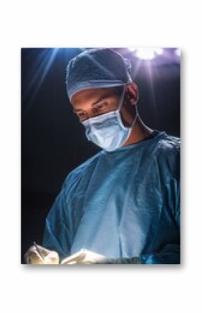 Plastic Surgeon Performing Surgery Under Bright Lights in Operating Room