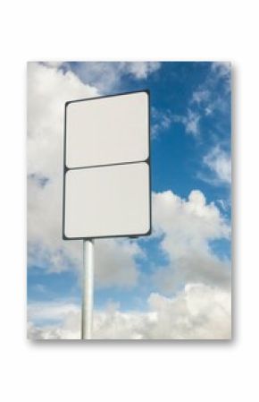 Blank sign post on cloudy sky