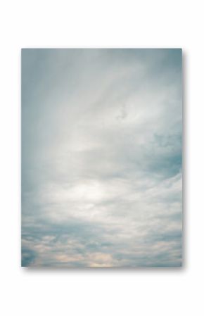 Soft overcast sky with layered clouds in muted blue and gray tones. Peaceful and dreamy natural background perfect for abstract, nature, or weather themes