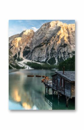 Calm Reflection at Lago di Braies or Pragser Wildsee at sunset.