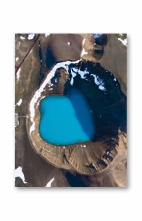 Krafla Crater features a stunning turquoise geothermal lake surrounded by rugged terrain and volcanic rock in Iceland