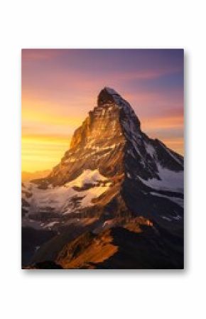 Sunlight hitting a dramatic mountain peak at golden hour