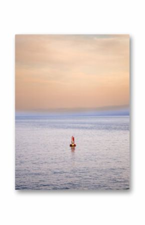 Bar Harbor, Maine Sunset in the Summer. Atlantic Ocean View with warm sky behind the lighthouse.