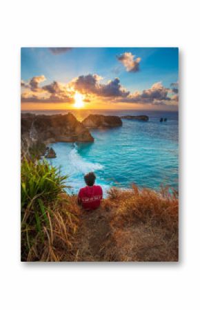 Sunrise view of scenic cliff islands and Diamond Beach at Nusa Penida, Indonesia. Crystal-clear turquoise water of the ocean. Wonderful sea view. Diamond Beach is a popular tourist attraction of Asia.
